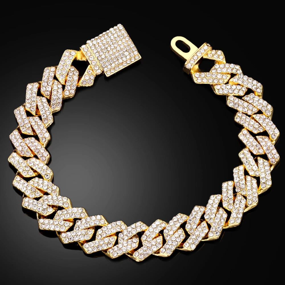 Gold Cuban link bracelet encrusted with clear rhinestones, featuring a secure iced-out box clasp, designed for bold hip hop and streetwear fashion.