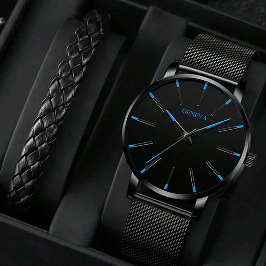 Minimalist black Geneva men’s wristwatch with mesh stainless steel band and matching braided bracelet, displayed in a box (note: box not included).